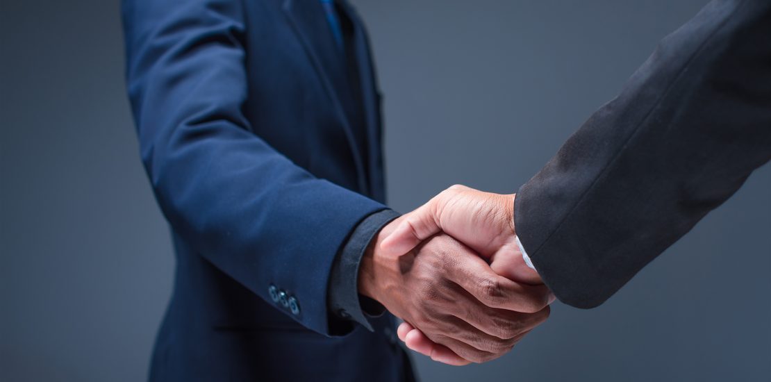 Business people shake hands in the office - Image